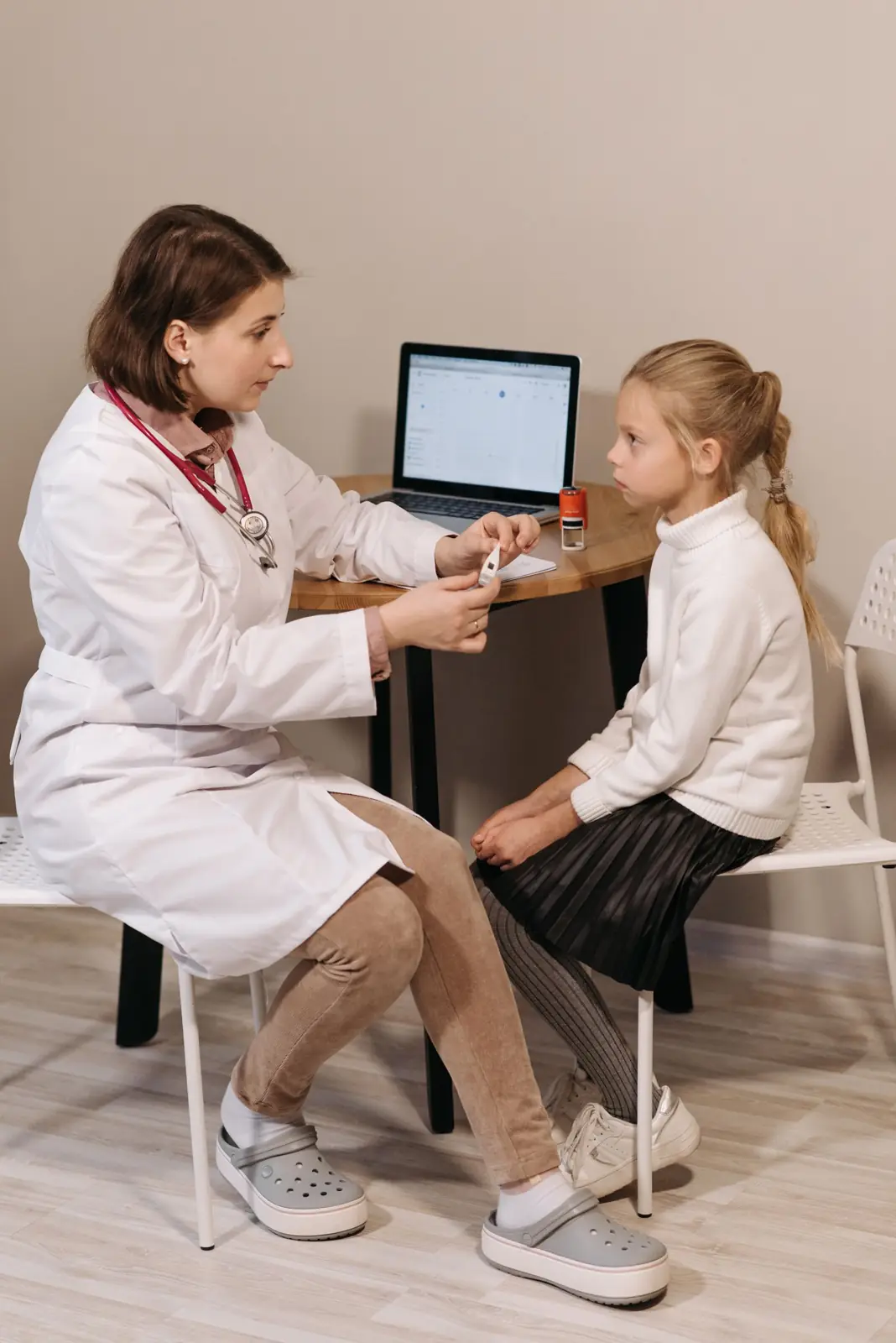 Doctor examining a young patient