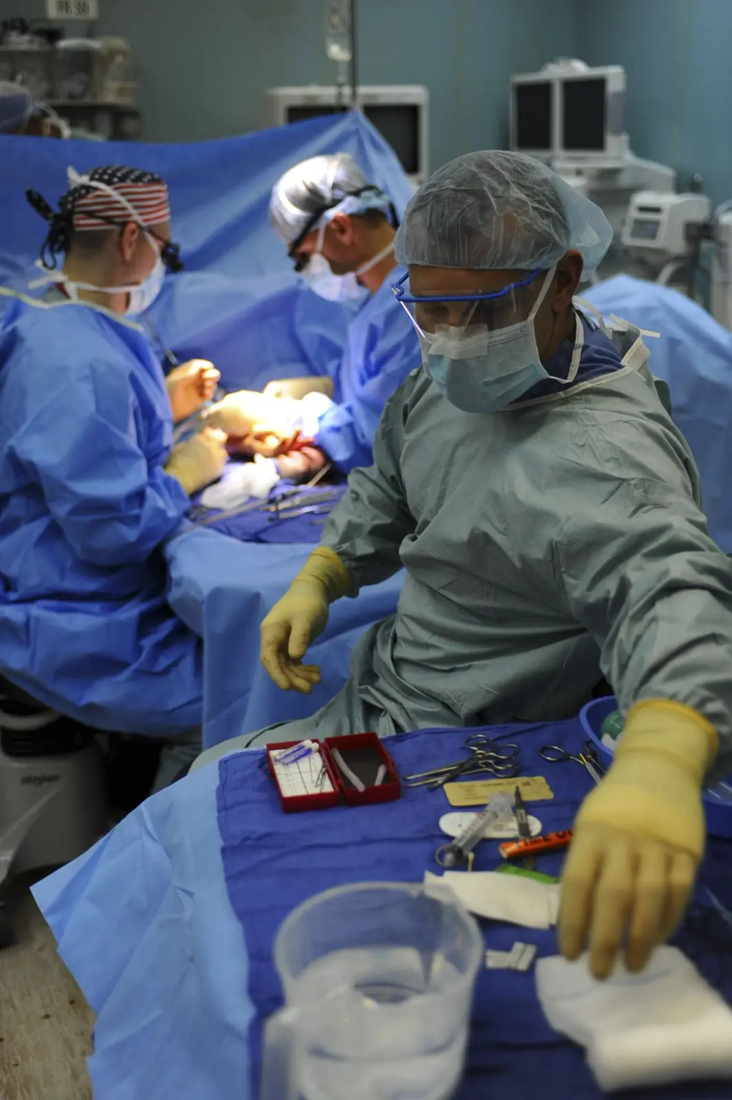 Surgical and anesthesia team gathered around a patient in the operating room