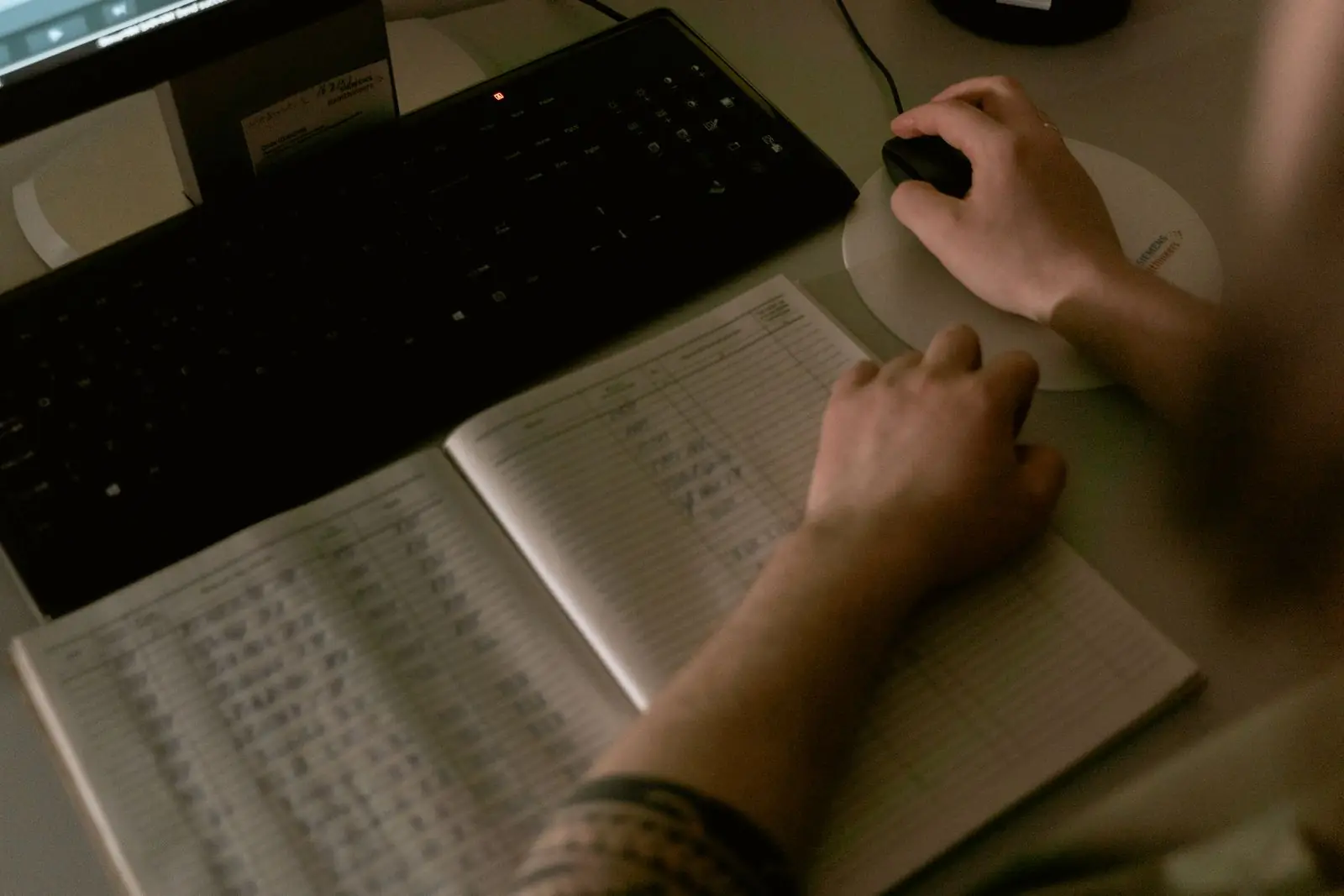 Healthcare worker reviewing billing data on a computer